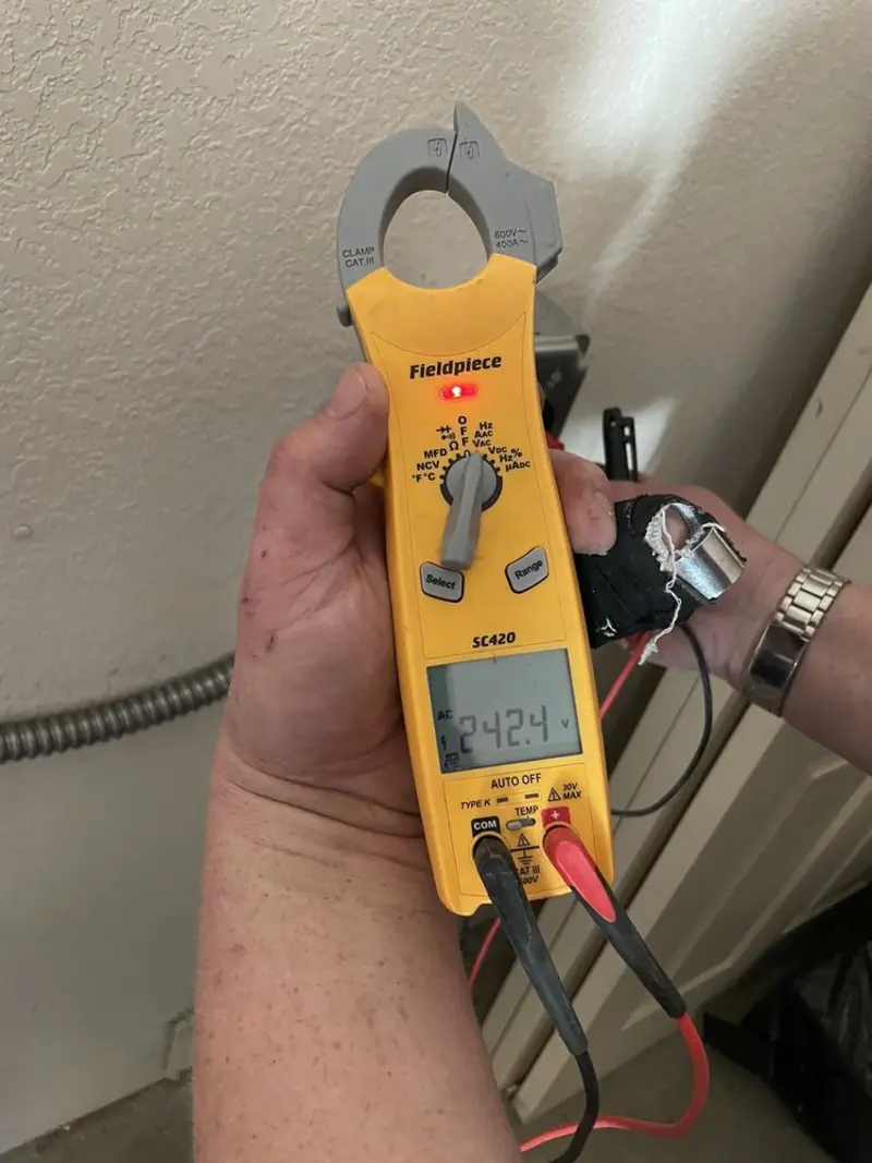 Voltage testing with clamp meter during Recessed Lighting Installation in North Lebanon